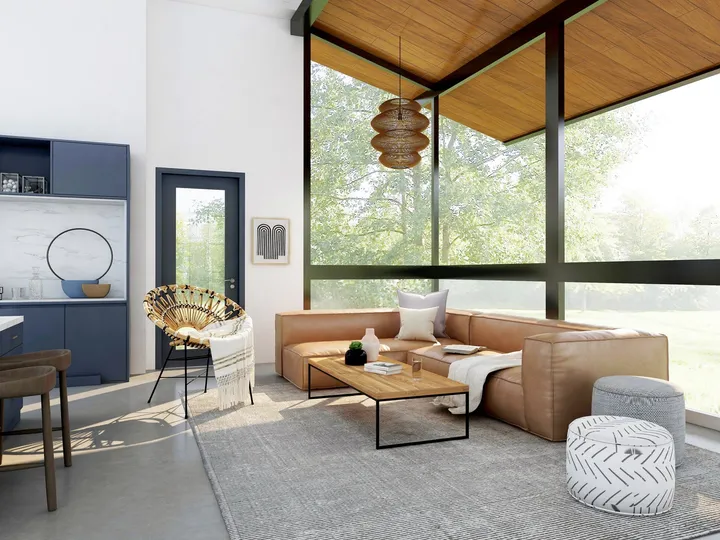 Séjour lumineux d’une maison contemporaine avec de grandes baies vitrées