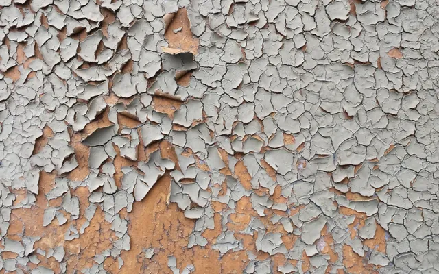 Ancienne peinture écaillée sur un mur